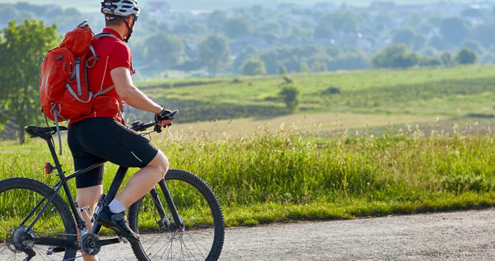 Cyclist taking a break to look at the view