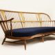 Ercol vintage sofa on pale background