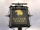 Pub sign for t/he Golden Eagle- gold eagle head on black background