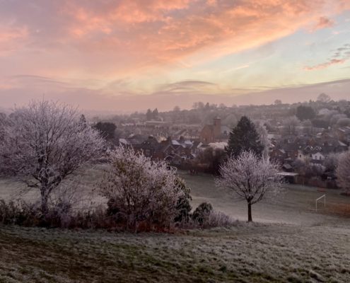 Frost descending on Nashleigh Hill at sunset, bright pink skies