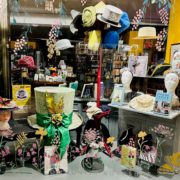 Window display from award-winning bookshop Chapter Two - hat display for Hats Off Festival
