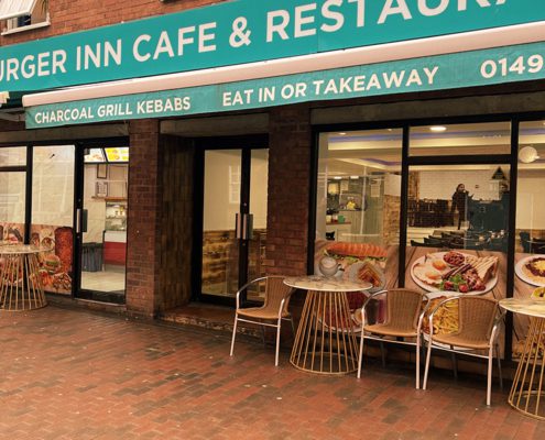 Exterior of Burger Inn cafe and restaurant with some outdoor seating