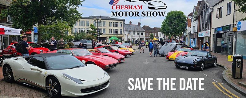 View of Chesham High Street with sports cars on show either side