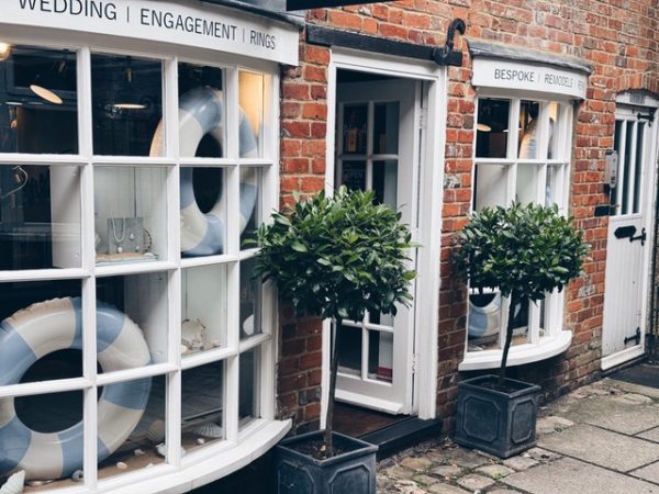 vasessen-walker-jewellery-chesham-8 Exterior of shop with small white paned bay windows and bay trees in pots either side of the doorway