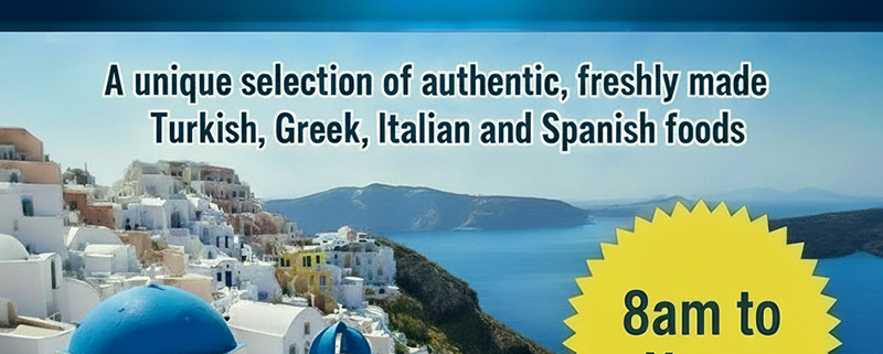 View of santorini - white houses, blue domed roof and turquoise sea